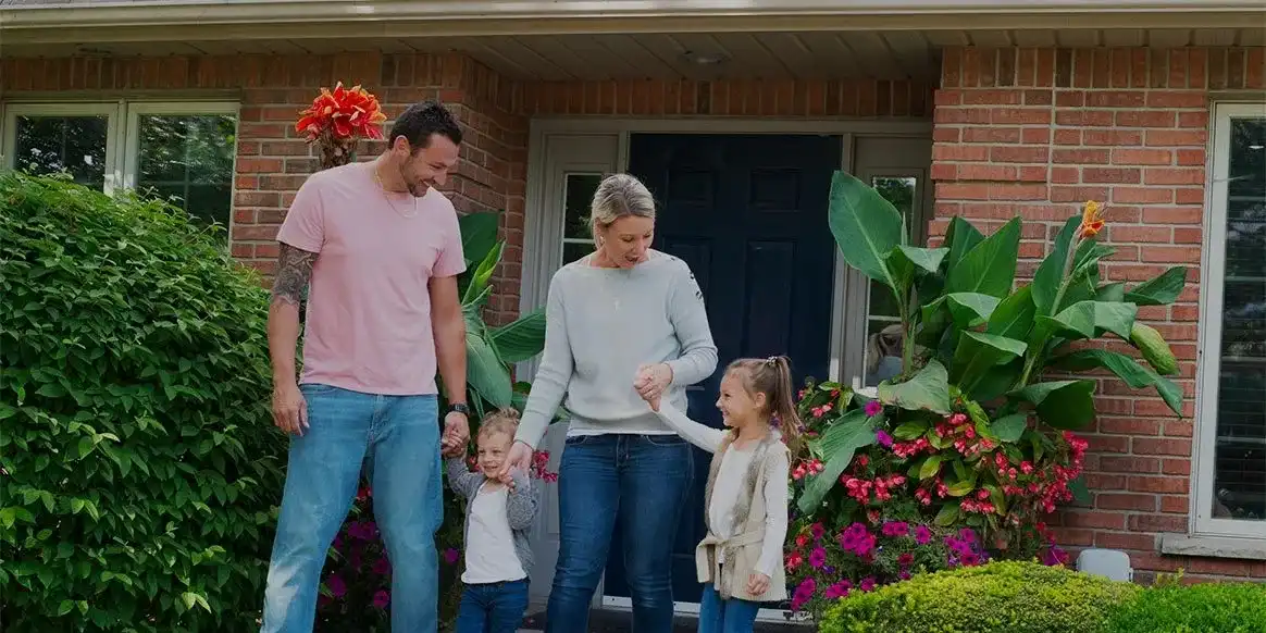 Family happily coming out of the office